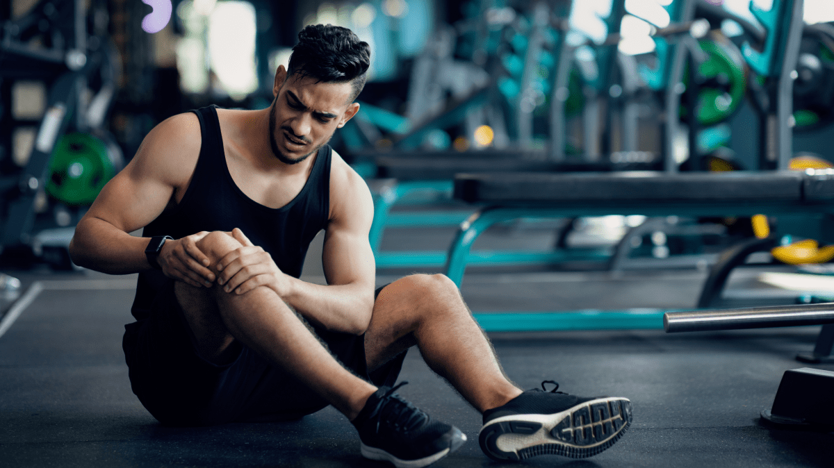 A man with knee strain | Ultimate Nutrition