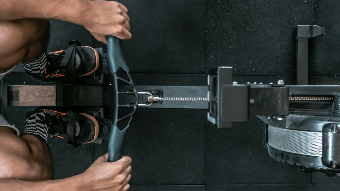 A coach and athlete rowing | Ultimate Nutrition