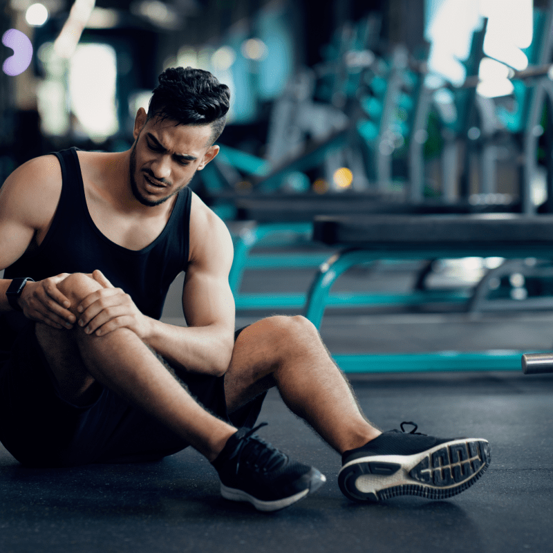 A man with knee strain | Ultimate Nutrition
