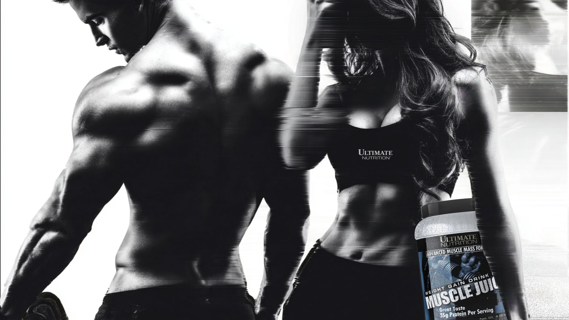 Person holding a supplement container with 'Ultimate Nutrition' branding, against a blurred background.